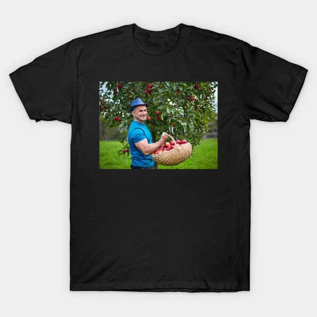 Farmer picking apples in a basket T-Shirt by naturalis